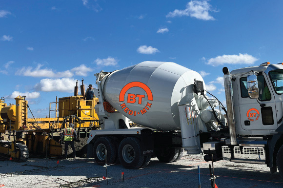 BT Redi mix cement mixing truck pouring concrete slab
